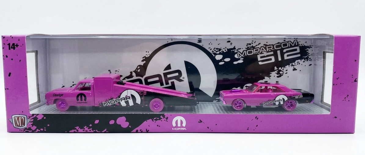 Pink toy cars with a Mopar logo in a clear display box on a white background