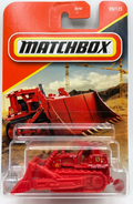 Red bulldozer toy in Matchbox packaging on a white background