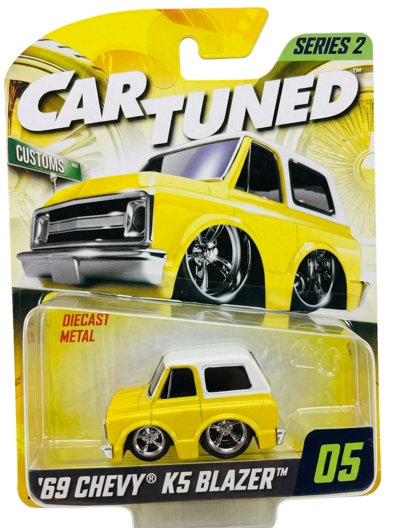 Yellow toy truck in packaging with 'Car Tuned' branding
