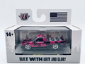 Model truck in packaging with 'M2' branding and American flag on a white background