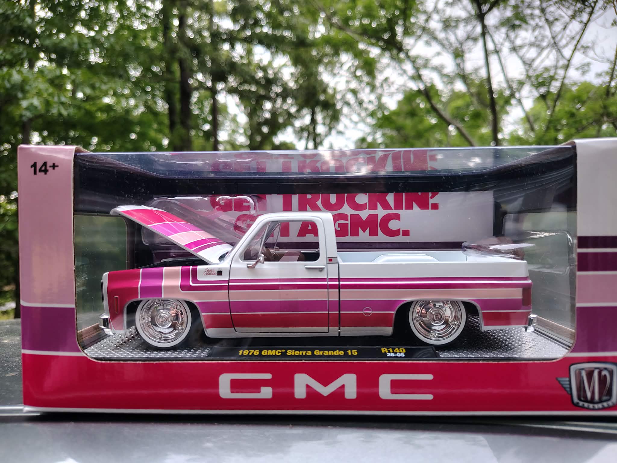 Model GMC truck in packaging with 'Get Truckin'' text