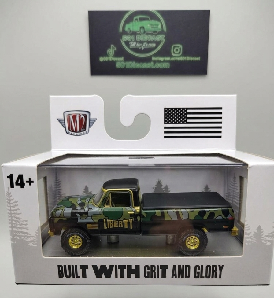 Model truck in packaging with 'Liberty' branding and 'Built with Grit and Glory' text.