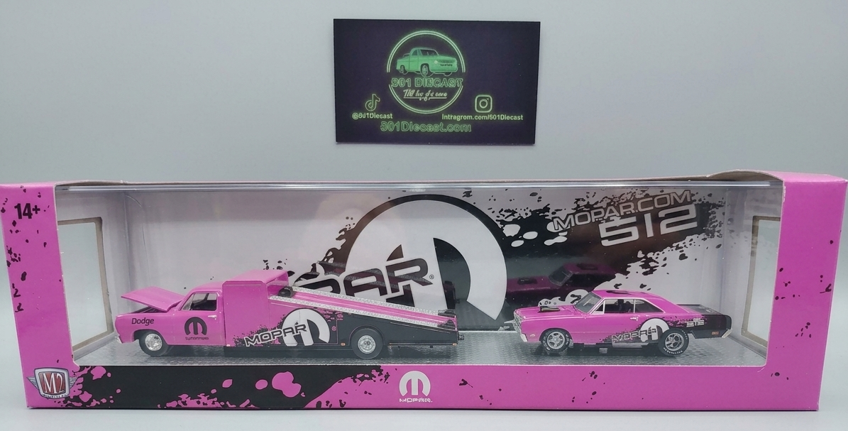 Model car set in a pink and black box with a visible brand logo.